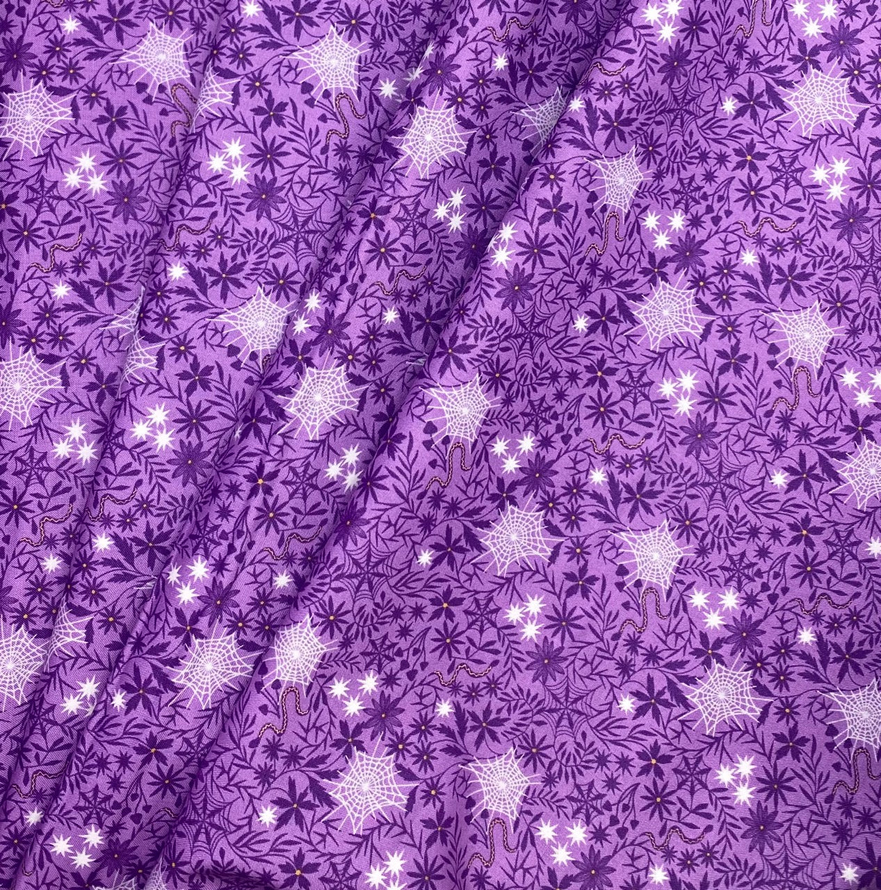 Floral cobwebs on light purple