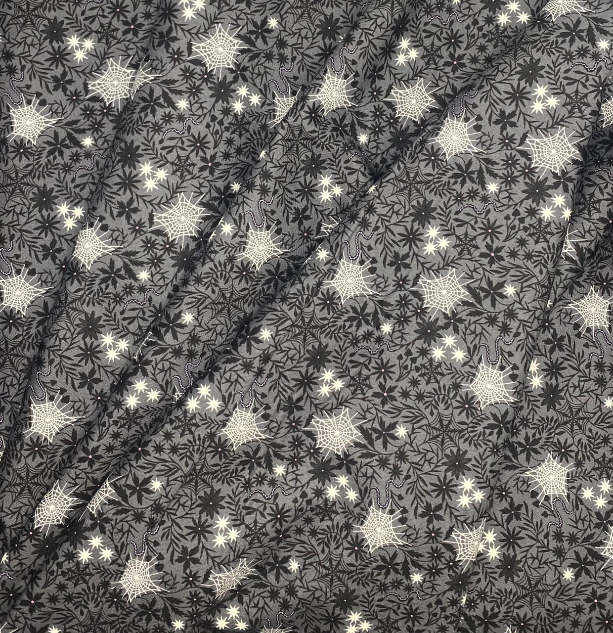 Floral cobwebs on grey