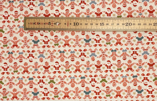 Gingerbread people on cream