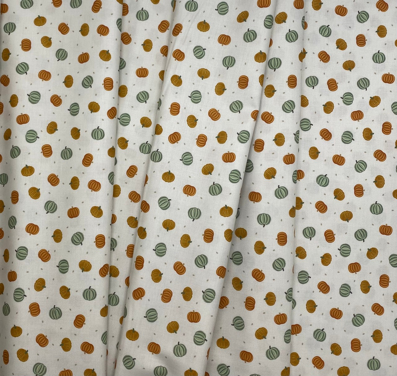 Pumpkins on cream