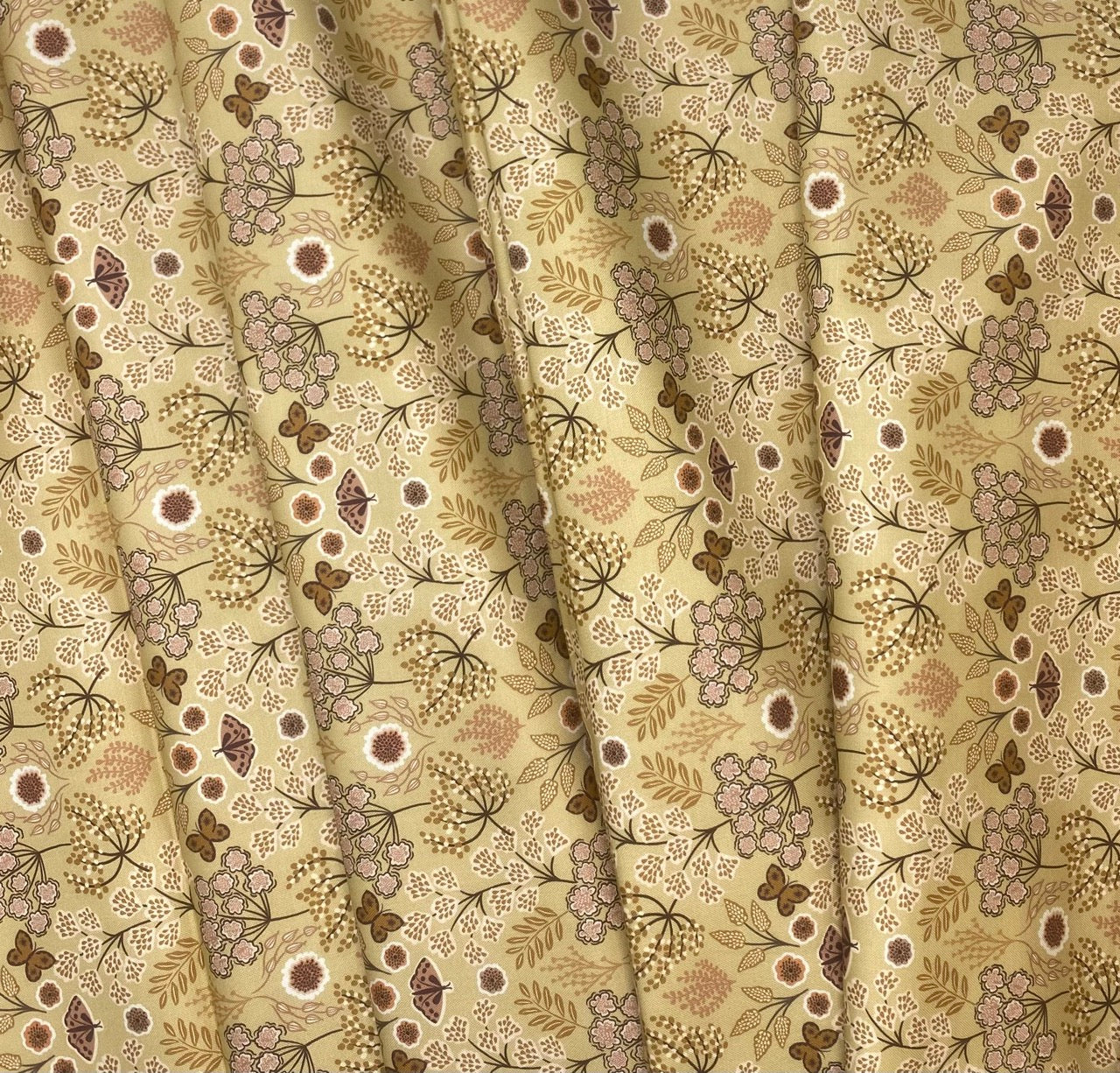 Large floral butterfly on warm gold
