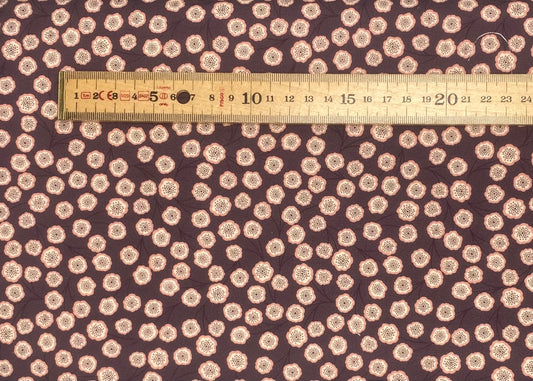 Simple flower on dark aubergine