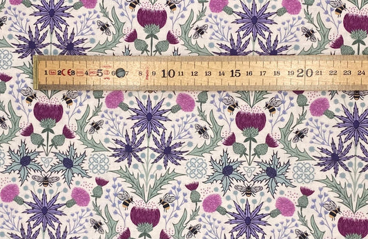 Mirrored thistle and bee on cream