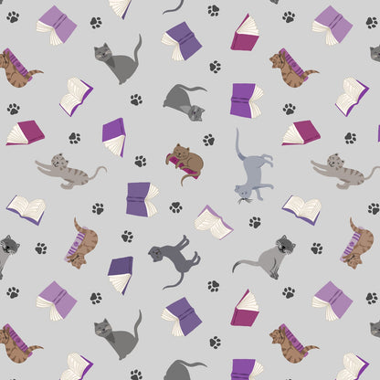 Scattered cats and books on grey