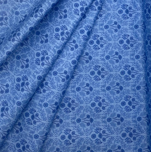 Woodland mushrooms on mid blue