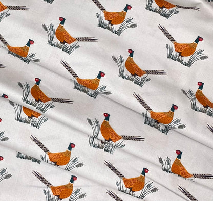 Pheasants on dark cream