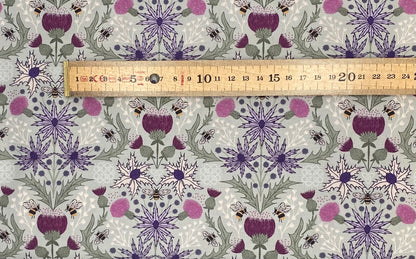 Mirrored thistle and bee on duck egg