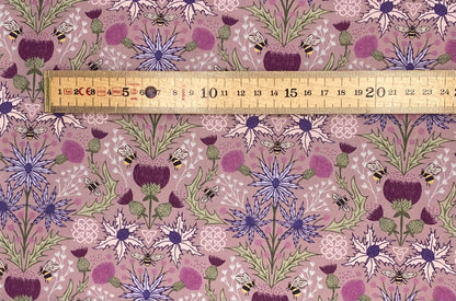 Mirrored thistle and bee on heather