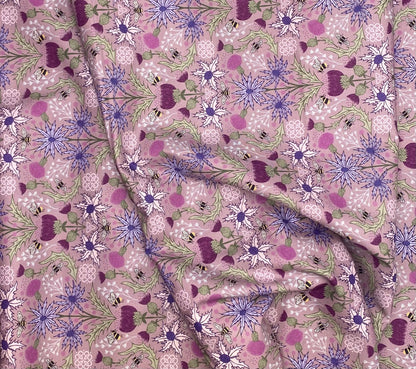 Mirrored thistle and bee on heather